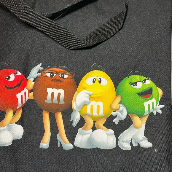 M&M's World graphic tote bag featuring several M&M's characters. - Picture 8 of 9